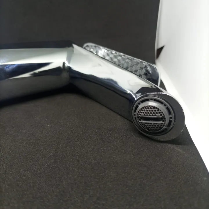A detailed close-up of the spout of the basin mixer, showing the filter mesh for smooth water flow from the bathroom faucet.