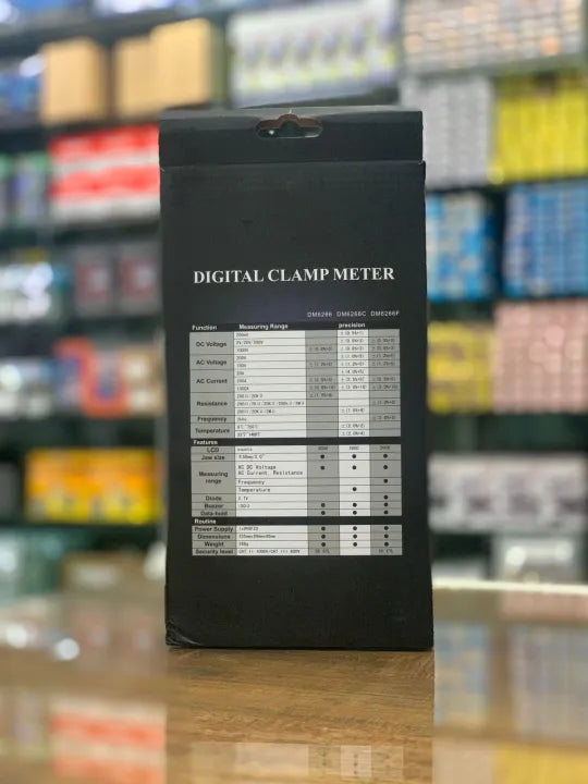 DM6266  Digital clamp meter packaging with specifications on a blurred background