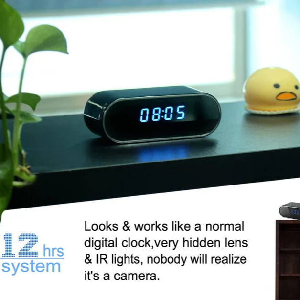 Digital wifi clock with hidden camera on a shelf next to a plant