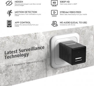 Spy Surveillance Mini Adapter camera device with USB port on a concrete wall background