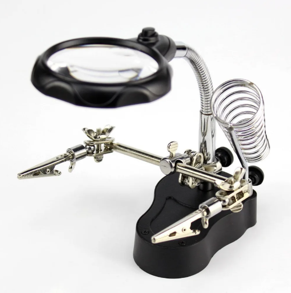 Soldering station with magnifying glass on a white background