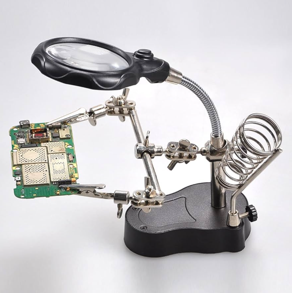 Soldering station with magnifying glass and electronic components (PCB) in its arms on a white background